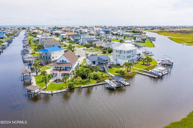 birds eye view of property featuring a residential view and a water view