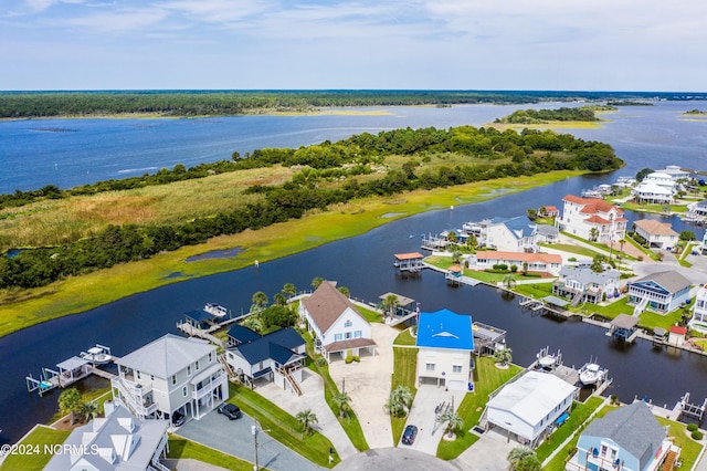 birds eye view of property featuring a water view and a residential view