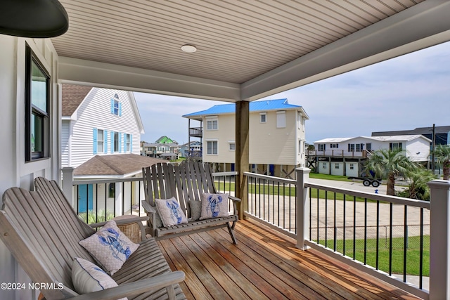 wooden terrace with a residential view