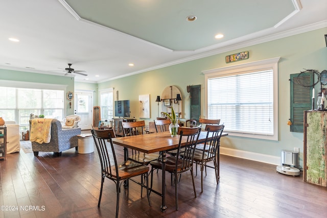 dining area featuring crown molding, dark hardwood / wood-style floors, ceiling fan, and plenty of natural light