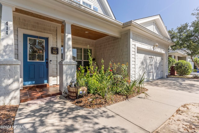 doorway to property featuring a garage