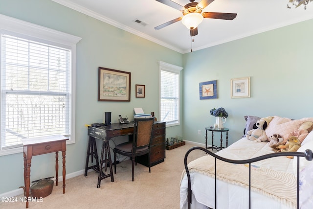 carpeted bedroom with crown molding and ceiling fan