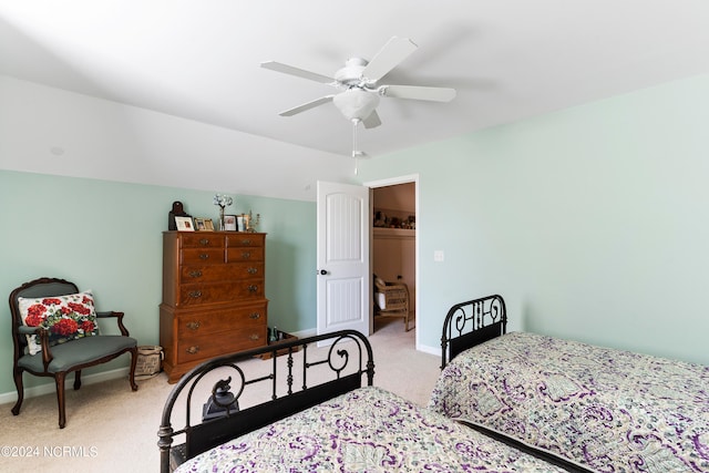 bedroom with ceiling fan and light carpet