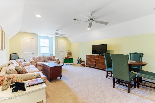 living room with light carpet, vaulted ceiling, and ceiling fan