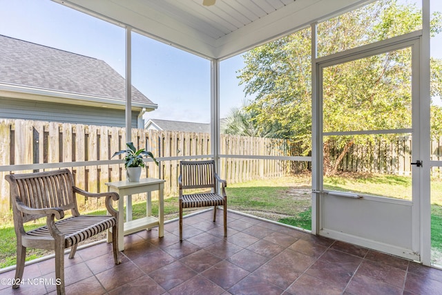 sunroom with wood ceiling and plenty of natural light