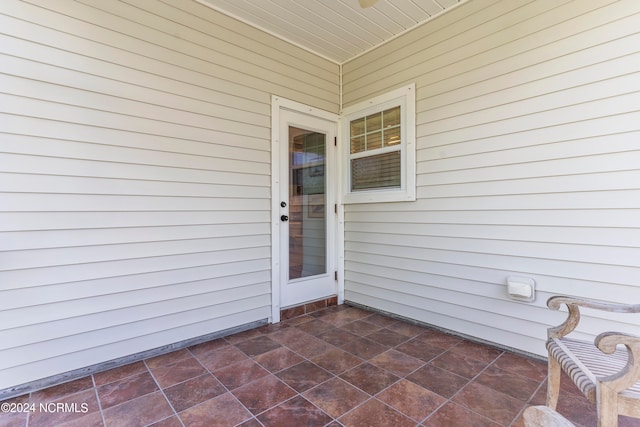 entrance to property with a patio area