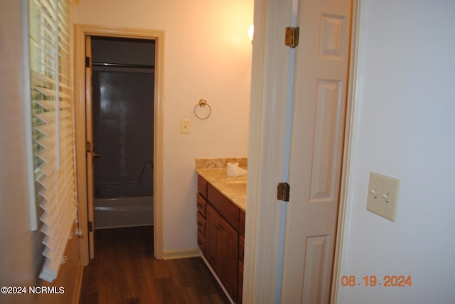 bathroom with hardwood / wood-style floors and vanity