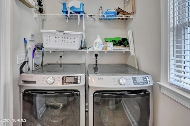 laundry area with laundry area and washer and clothes dryer