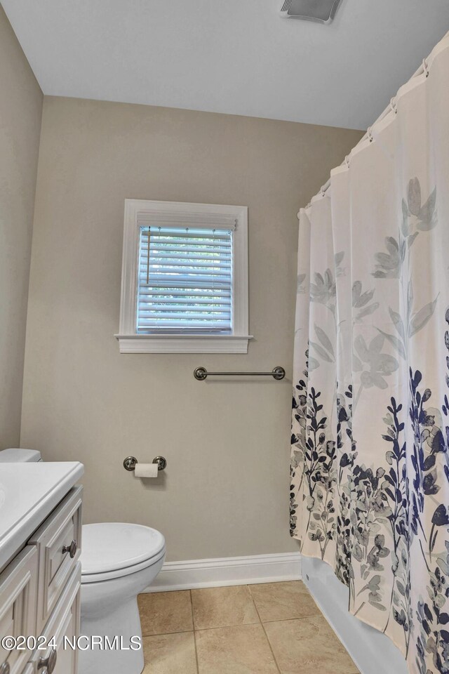 full bath with visible vents, toilet, vanity, baseboards, and tile patterned floors