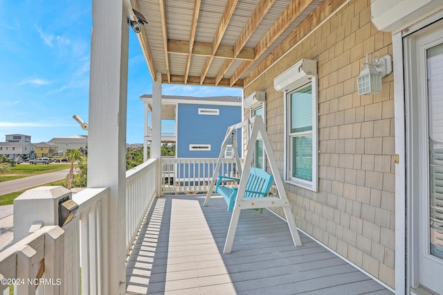 wooden terrace featuring a residential view