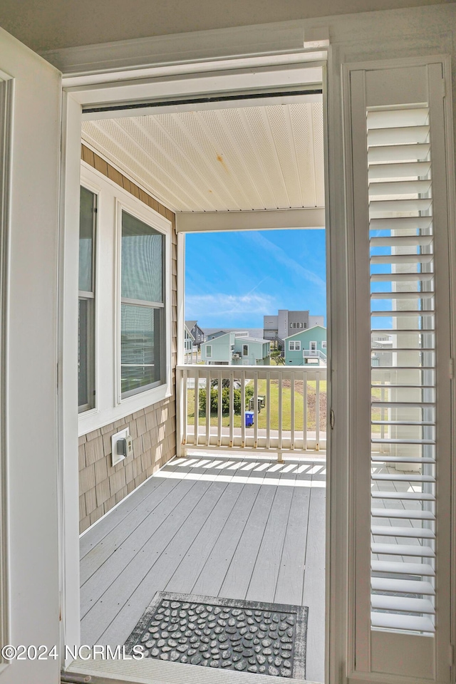 wooden deck with a residential view