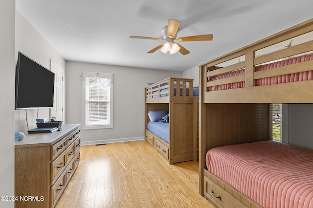 bedroom with light wood-type flooring and ceiling fan