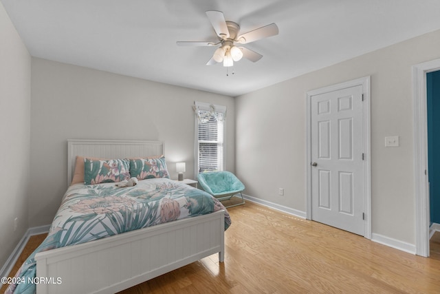 bedroom featuring light wood-type flooring and ceiling fan