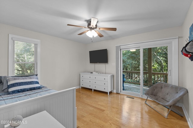 bedroom featuring light hardwood / wood-style floors, access to outside, and ceiling fan