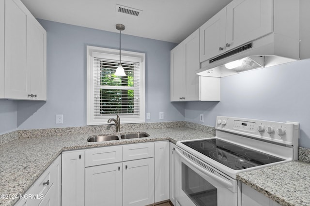 kitchen with sink, light stone counters, white range with electric stovetop, white cabinetry, and pendant lighting