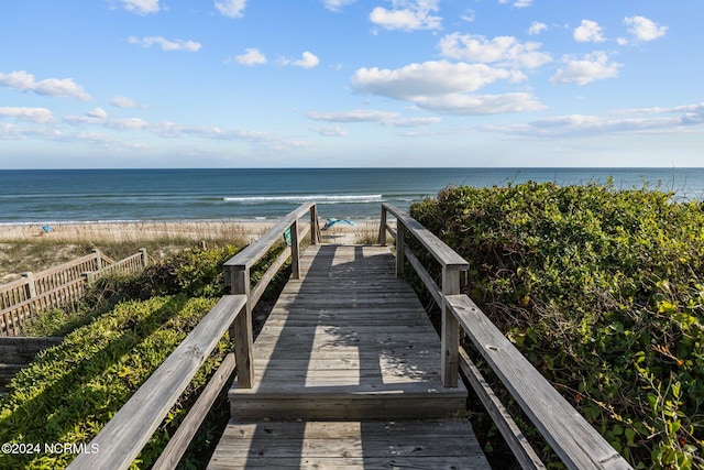 surrounding community featuring a water view