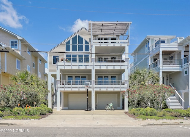 view of front facade featuring a balcony and a garage