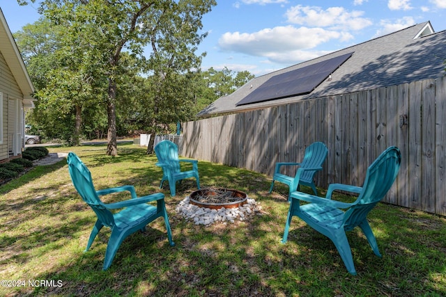 view of yard with a fire pit