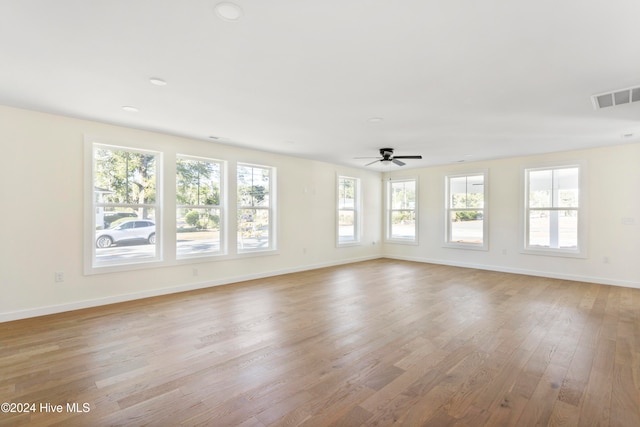 unfurnished room featuring light hardwood / wood-style floors and ceiling fan