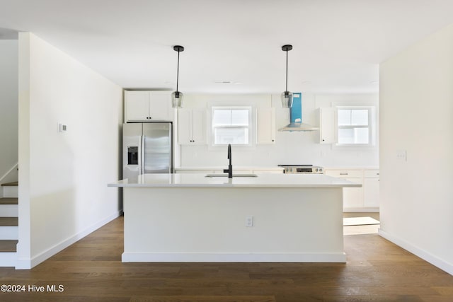 kitchen with white cabinetry, wall chimney exhaust hood, backsplash, stainless steel electric range oven, and light hardwood / wood-style flooring