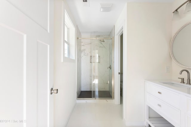 bathroom with tile patterned flooring, an enclosed shower, vanity, and toilet