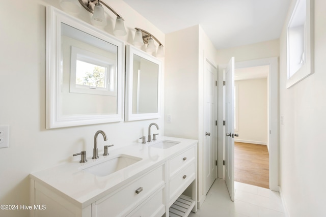 bathroom featuring hardwood / wood-style floors and vanity