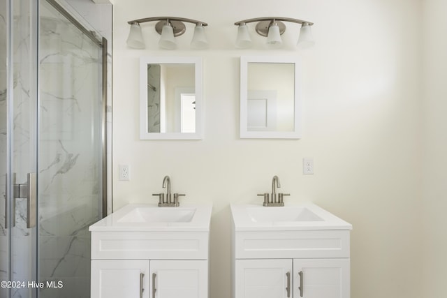 unfurnished bedroom featuring ceiling fan, ensuite bath, and light hardwood / wood-style flooring