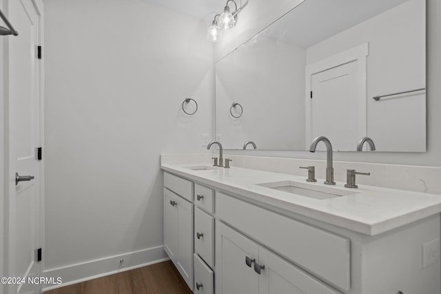 bathroom with wood-type flooring and vanity