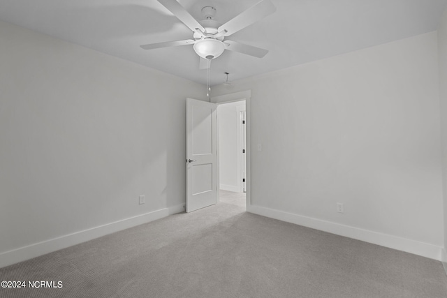 carpeted empty room with ceiling fan