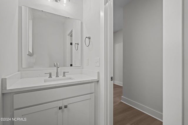 bathroom featuring wood-type flooring and vanity