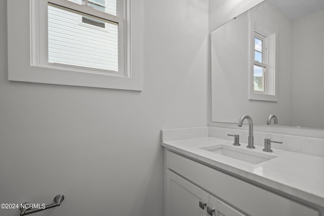 bathroom with vanity and a wealth of natural light