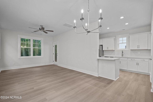 kitchen featuring white cabinetry, light hardwood / wood-style flooring, and plenty of natural light