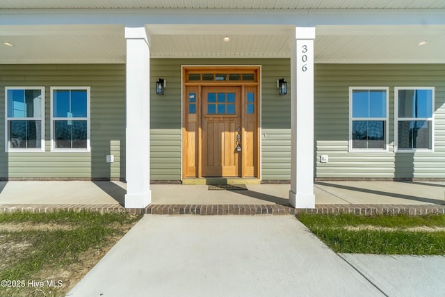 entrance to property featuring a porch