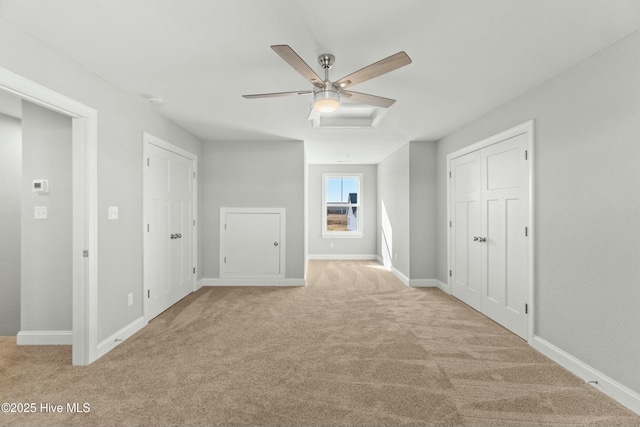 unfurnished bedroom with light carpet and ceiling fan