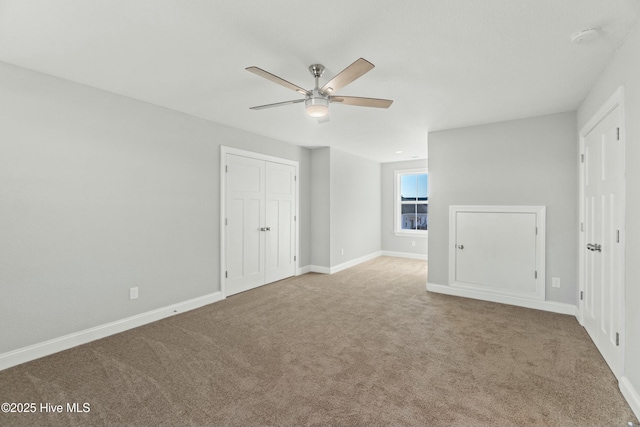 unfurnished bedroom featuring carpet floors and ceiling fan