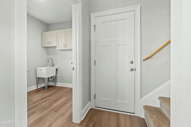 laundry room featuring light hardwood / wood-style flooring