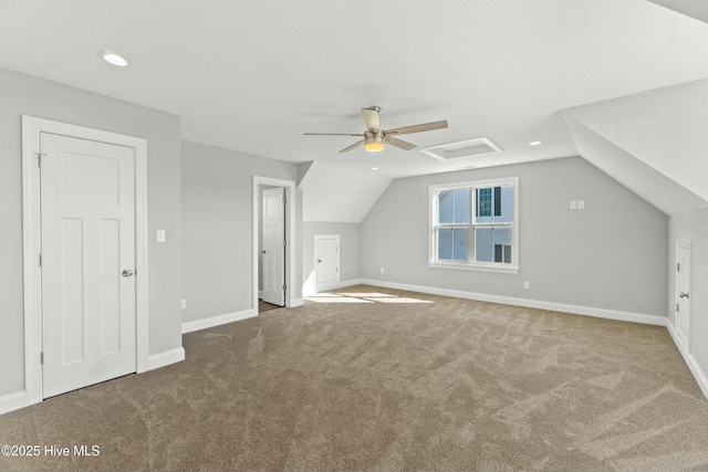 bonus room with vaulted ceiling, ceiling fan, and carpet