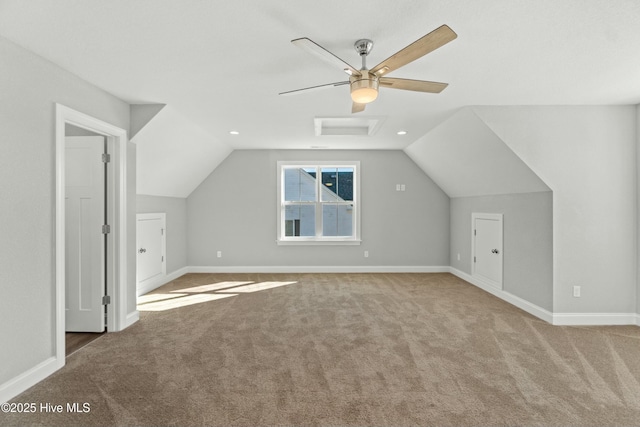 bonus room with carpet floors and vaulted ceiling