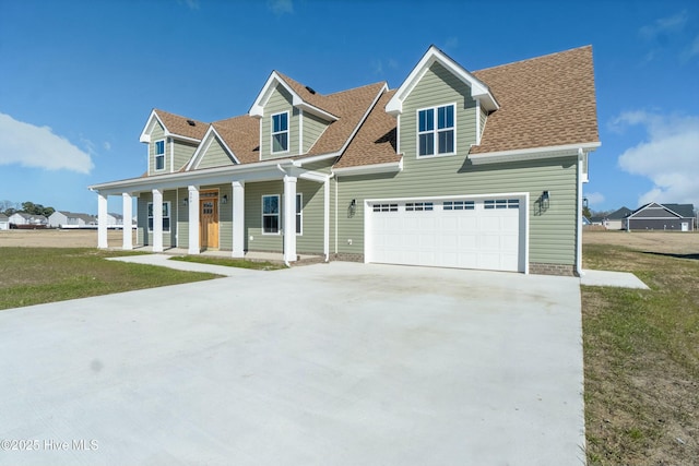 cape cod house featuring a garage, a porch, and a front lawn