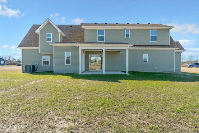 back of house with a lawn, a patio, and central air condition unit