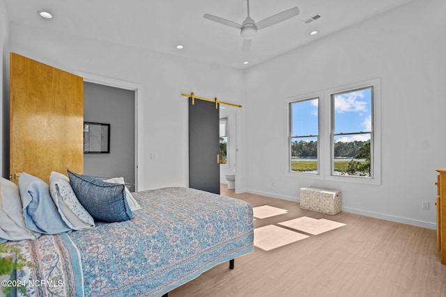 bedroom featuring hardwood / wood-style flooring and ceiling fan