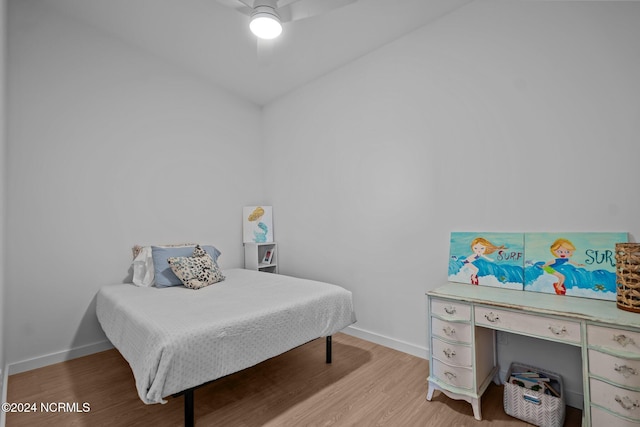 bedroom with light hardwood / wood-style flooring and ceiling fan