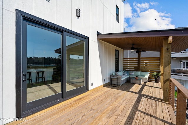 deck featuring outdoor lounge area and ceiling fan