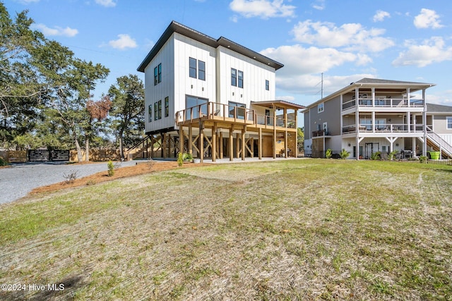 rear view of property with a yard