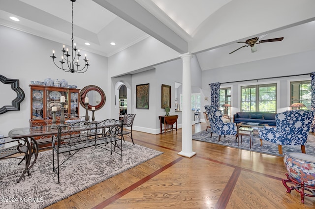 dining area with decorative columns, baseboards, wood finished floors, ceiling fan with notable chandelier, and recessed lighting