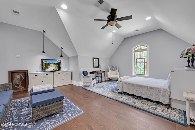 bedroom featuring lofted ceiling, visible vents, and wood finished floors