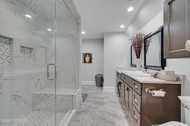 full bath with recessed lighting, marble finish floor, vanity, and a marble finish shower