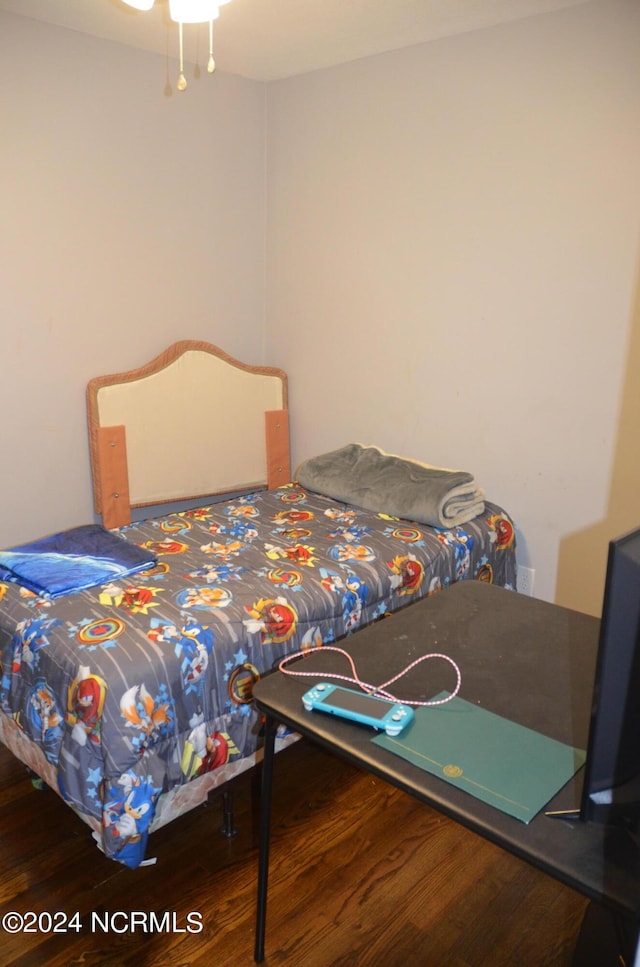 bedroom with wood finished floors