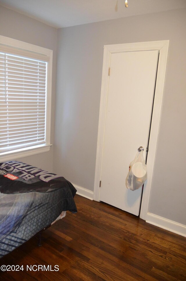 bedroom with hardwood / wood-style flooring