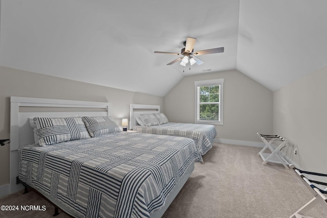 bedroom featuring carpet flooring, ceiling fan, and vaulted ceiling